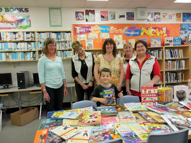 l to r: Librarian Olivia Kirkpatrick, Lois, Nathan, Principal Diane McGonigle, Chris and Janet. That’s an impressive array of books!