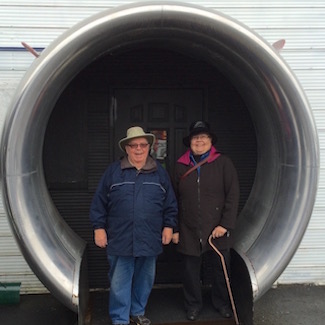 Ted MacKinnon and Carole Nelson posed inside a 747 engine intake.