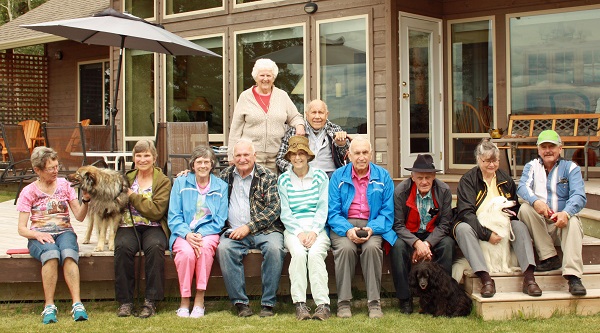  A group picture with our furry friends.  Abby, Maggie and Shylo were on hand for this year's merriment.