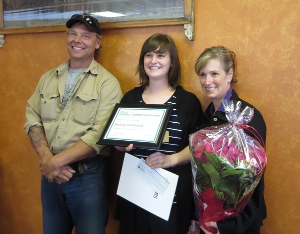 Kelsey's parents, Patti and Neil Blockland, joined Kelsey for this significant presentation.